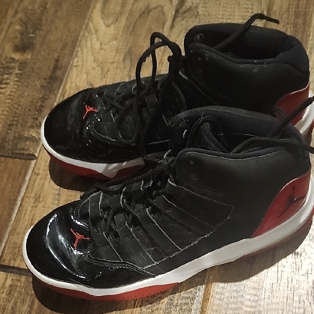 Nike Air Jordan Black and Red High Tops